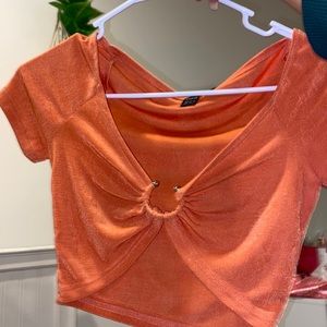 orange cami top open in the middle size small and XS